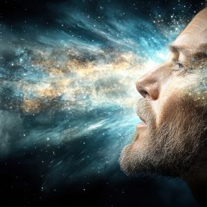 A surreal image of human head revealing cosmic explosion of colors and light