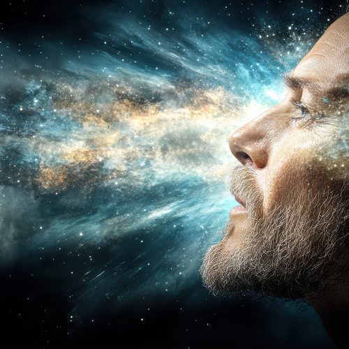 A surreal image of human head revealing cosmic explosion of colors and light