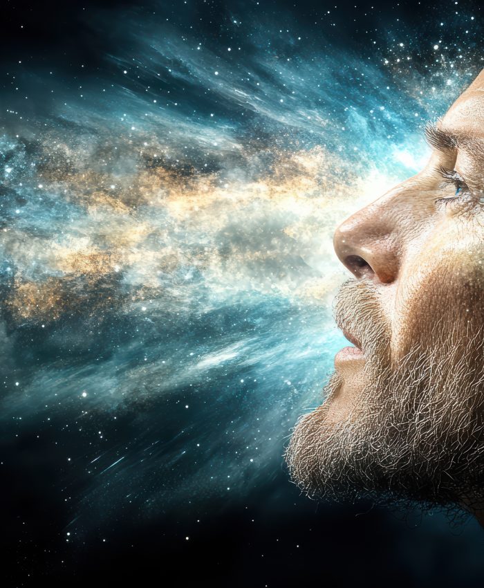 A surreal image of human head revealing cosmic explosion of colors and light