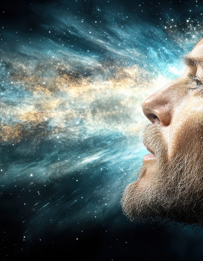 A surreal image of human head revealing cosmic explosion of colors and light